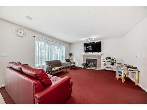 67 Sherwood Common Nw, Calgary, AB - Indoor Photo Showing Living Room With Fireplace