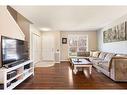 209 Elgin Meadows Park Se, Calgary, AB  - Indoor Photo Showing Living Room 