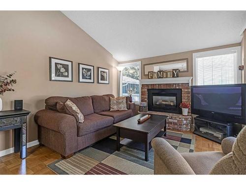 124 Midpark Drive Se, Calgary, AB - Indoor Photo Showing Living Room With Fireplace