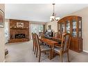 124 Midpark Drive Se, Calgary, AB  - Indoor Photo Showing Dining Room With Fireplace 