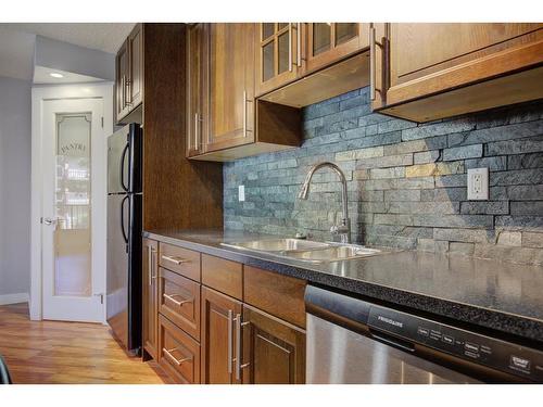 210-515 57 Avenue Sw, Calgary, AB - Indoor Photo Showing Kitchen With Double Sink