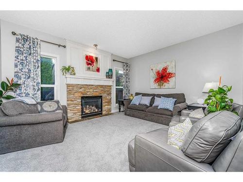 11 Aspen Hills Close Sw, Calgary, AB - Indoor Photo Showing Living Room With Fireplace