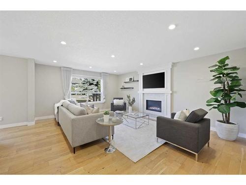 252 Sierra Madre Court Sw, Calgary, AB - Indoor Photo Showing Living Room With Fireplace