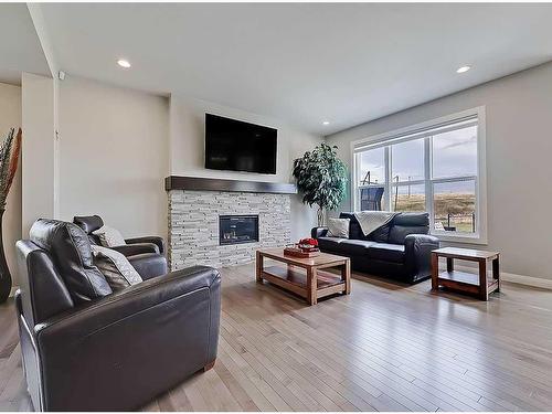 116 Cranarch Crescent Se, Calgary, AB - Indoor Photo Showing Living Room With Fireplace