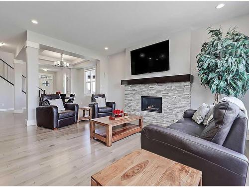 116 Cranarch Crescent Se, Calgary, AB - Indoor Photo Showing Living Room With Fireplace