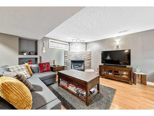 412 Christie Knoll Point Sw, Calgary, AB - Indoor Photo Showing Living Room With Fireplace