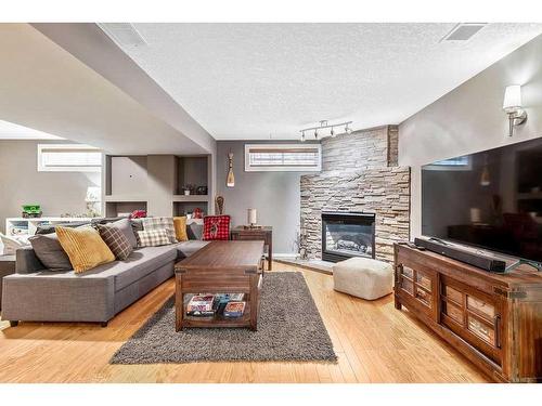 412 Christie Knoll Point Sw, Calgary, AB - Indoor Photo Showing Living Room With Fireplace