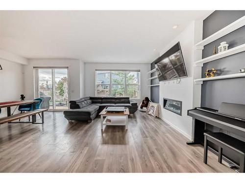 216 Masters Crescent Se, Calgary, AB - Indoor Photo Showing Living Room With Fireplace