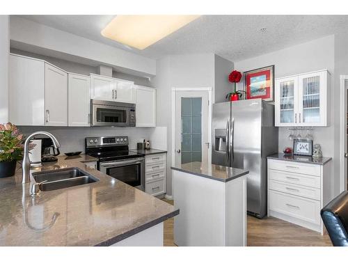 2345-151 Country Village Road Ne, Calgary, AB - Indoor Photo Showing Kitchen With Stainless Steel Kitchen With Double Sink With Upgraded Kitchen