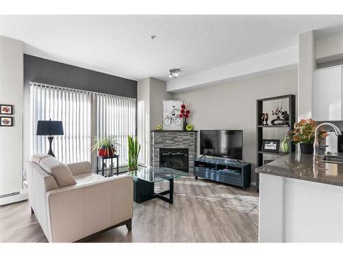 2345-151 Country Village Road Ne, Calgary, AB - Indoor Photo Showing Living Room With Fireplace