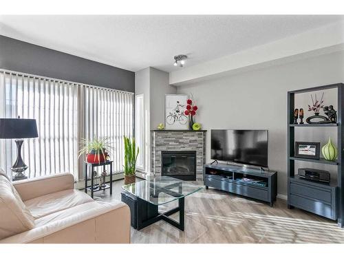 2345-151 Country Village Road Ne, Calgary, AB - Indoor Photo Showing Living Room With Fireplace