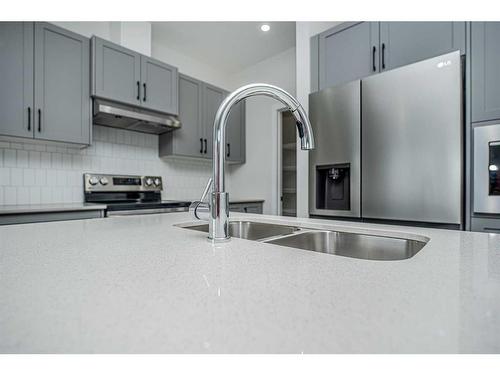 954 Bayview Rise Sw, Airdrie, AB - Indoor Photo Showing Kitchen With Double Sink With Upgraded Kitchen