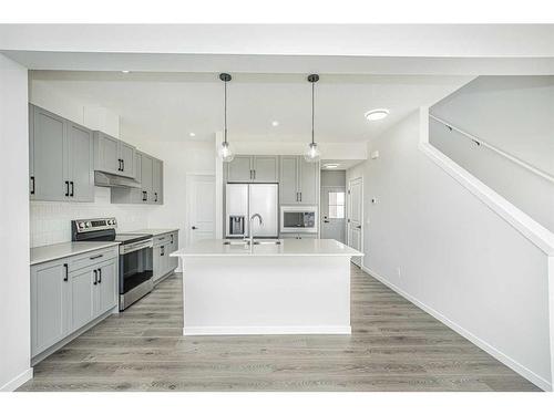 954 Bayview Rise Sw, Airdrie, AB - Indoor Photo Showing Kitchen With Double Sink With Upgraded Kitchen