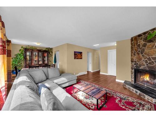 63 Whitnel Close Ne, Calgary, AB - Indoor Photo Showing Living Room With Fireplace