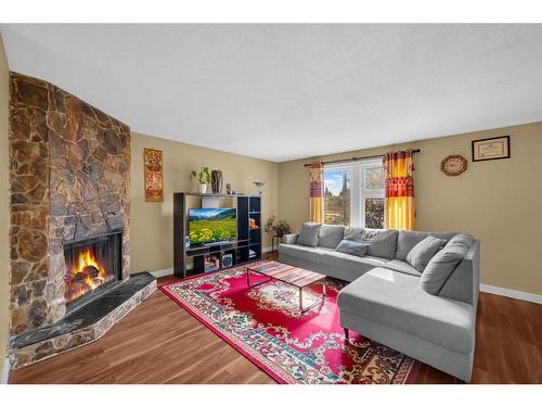 63 Whitnel Close Ne, Calgary, AB - Indoor Photo Showing Living Room With Fireplace