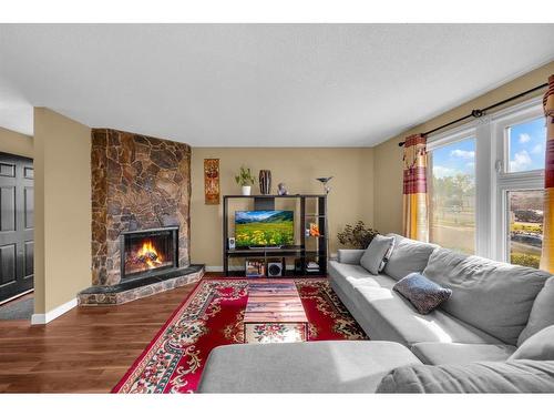 63 Whitnel Close Ne, Calgary, AB - Indoor Photo Showing Living Room With Fireplace