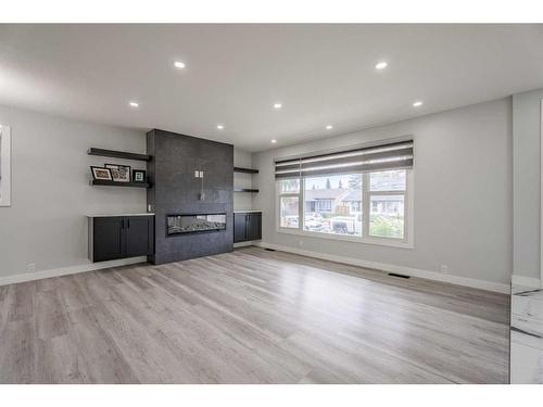 228 Pinecrest Crescent Ne, Calgary, AB - Indoor With Fireplace