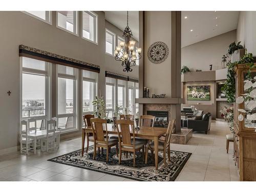 16159 265 Avenue West, Rural Foothills County, AB - Indoor Photo Showing Dining Room With Fireplace