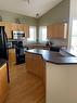 59 Royal Birch Street Nw, Calgary, AB  - Indoor Photo Showing Kitchen With Double Sink 