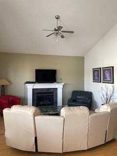 59 Royal Birch Street Nw, Calgary, AB - Indoor Photo Showing Living Room With Fireplace