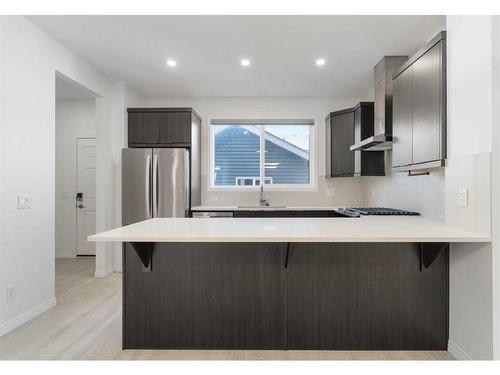 15 Heirloom Boulevard Se, Calgary, AB - Indoor Photo Showing Kitchen With Upgraded Kitchen