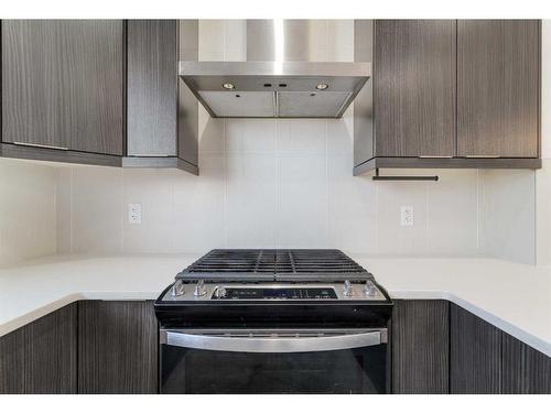 15 Heirloom Boulevard Se, Calgary, AB - Indoor Photo Showing Kitchen