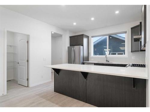 15 Heirloom Boulevard Se, Calgary, AB - Indoor Photo Showing Kitchen