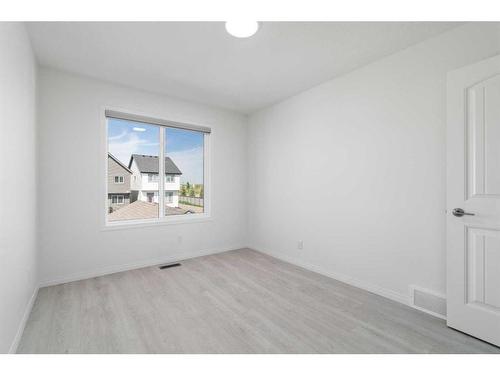 15 Heirloom Boulevard Se, Calgary, AB - Indoor Photo Showing Other Room