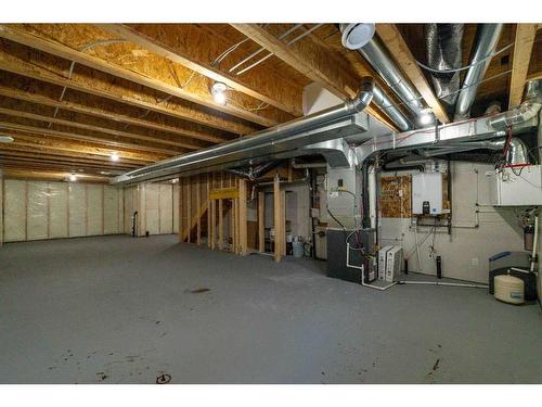 15 Heirloom Boulevard Se, Calgary, AB - Indoor Photo Showing Basement