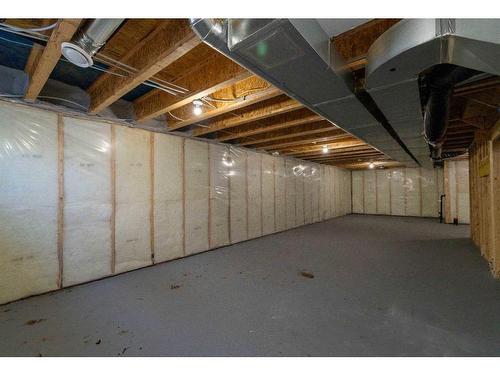 15 Heirloom Boulevard Se, Calgary, AB - Indoor Photo Showing Basement