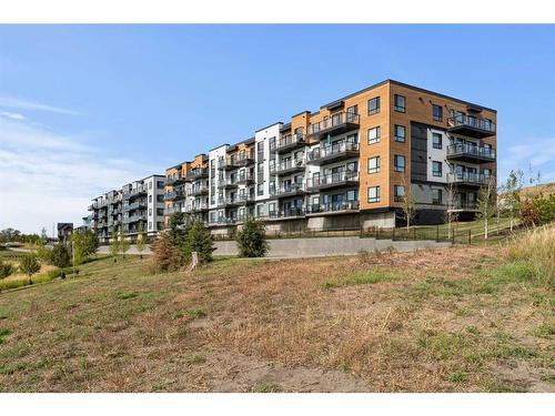 2407-42 Cranbrook Gardens Se, Calgary, AB - Outdoor With Balcony With Facade