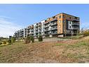 2407-42 Cranbrook Gardens Se, Calgary, AB  - Outdoor With Balcony With Facade 