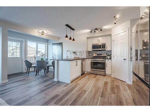 2046 Bridlemeadows Manor Sw, Calgary, AB - Indoor Photo Showing Kitchen With Upgraded Kitchen