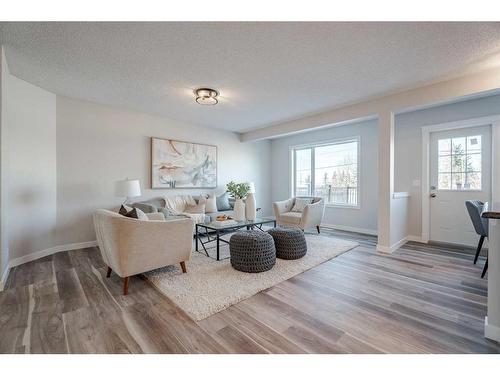 2046 Bridlemeadows Manor Sw, Calgary, AB - Indoor Photo Showing Living Room