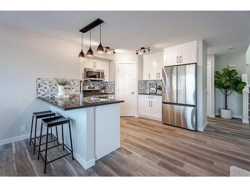 2046 Bridlemeadows Manor Sw, Calgary, AB - Indoor Photo Showing Kitchen With Upgraded Kitchen