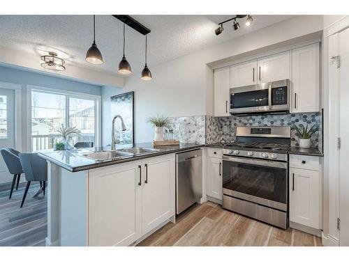 2046 Bridlemeadows Manor Sw, Calgary, AB - Indoor Photo Showing Kitchen With Double Sink With Upgraded Kitchen