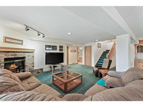 181 Hamptons Green Nw, Calgary, AB - Indoor Photo Showing Living Room With Fireplace