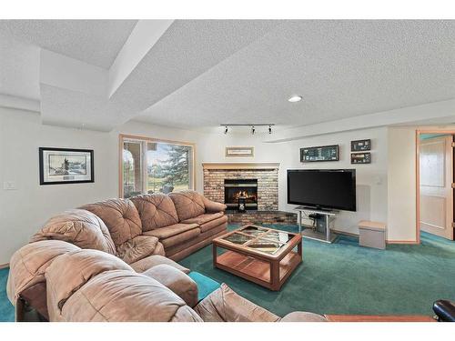 181 Hamptons Green Nw, Calgary, AB - Indoor Photo Showing Living Room With Fireplace