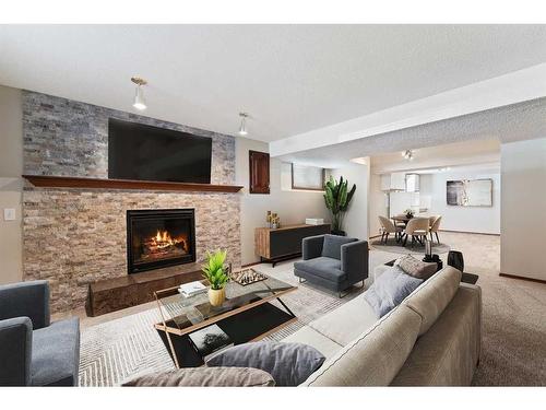 11 Sandringham Close Nw, Calgary, AB - Indoor Photo Showing Living Room With Fireplace