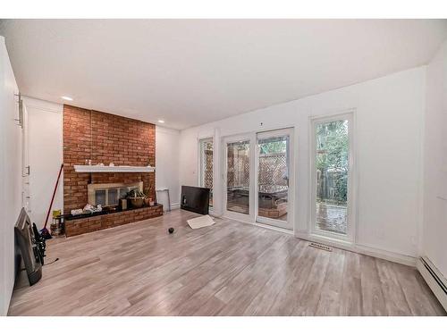 127 Sunmills Place Se, Calgary, AB - Indoor Photo Showing Living Room With Fireplace