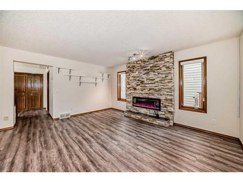 105 Coral Sands Terrace Ne, Calgary, AB - Indoor Photo Showing Living Room With Fireplace