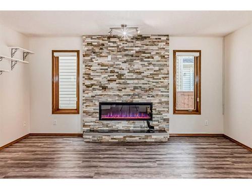 105 Coral Sands Terrace Ne, Calgary, AB - Indoor Photo Showing Other Room With Fireplace