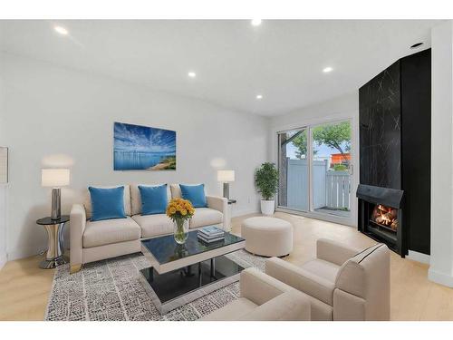 45-3705 Fonda Way Se, Calgary, AB - Indoor Photo Showing Living Room With Fireplace