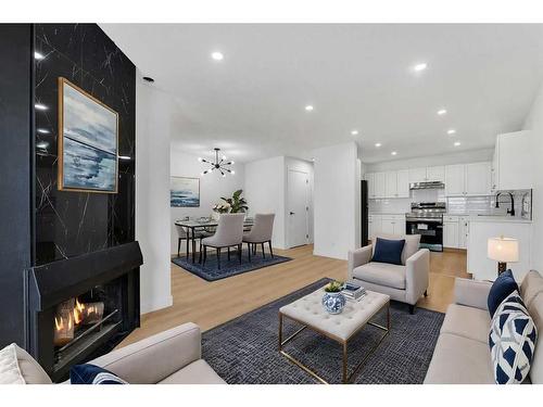 45-3705 Fonda Way Se, Calgary, AB - Indoor Photo Showing Living Room With Fireplace