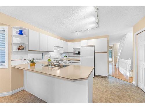 2110 1 Avenue Nw, Calgary, AB - Indoor Photo Showing Kitchen With Double Sink