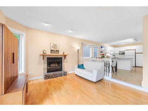 2110 1 Avenue Nw, Calgary, AB - Indoor Photo Showing Living Room With Fireplace