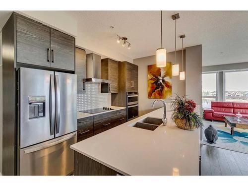 302-11 Mahogany Circle Se, Calgary, AB - Indoor Photo Showing Kitchen With Stainless Steel Kitchen With Double Sink With Upgraded Kitchen