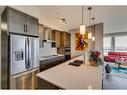 302-11 Mahogany Circle Se, Calgary, AB  - Indoor Photo Showing Kitchen With Stainless Steel Kitchen With Double Sink With Upgraded Kitchen 