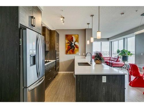 302-11 Mahogany Circle Se, Calgary, AB - Indoor Photo Showing Kitchen With Stainless Steel Kitchen With Double Sink With Upgraded Kitchen