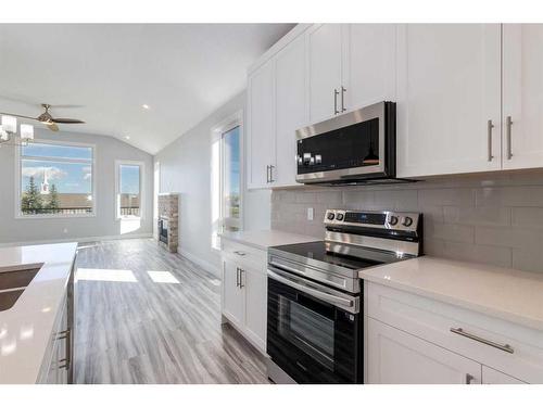 20 Country Meadows Cove, Diamond Valley, AB - Indoor Photo Showing Kitchen